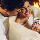 young couple by fire